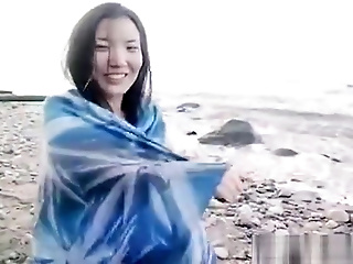 Asian Slut Is On The Beach Naked Posing